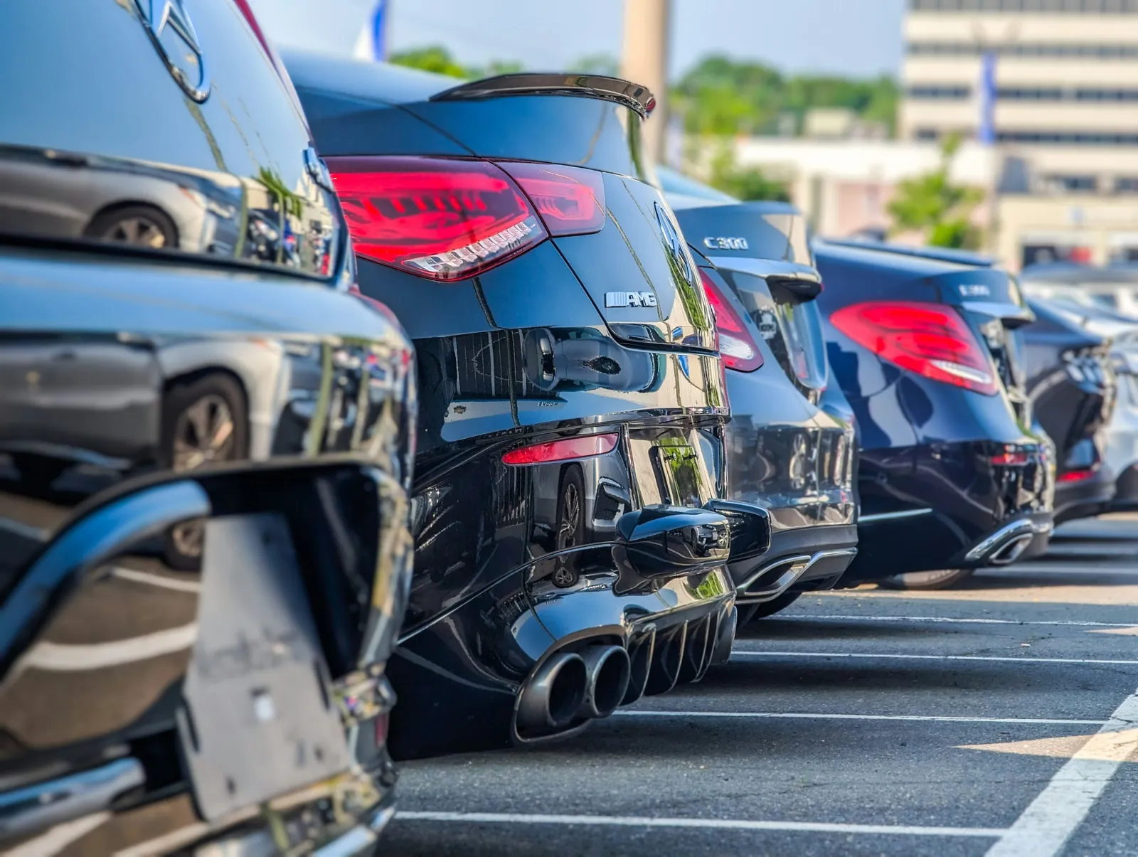 A row of cars in a parking lot